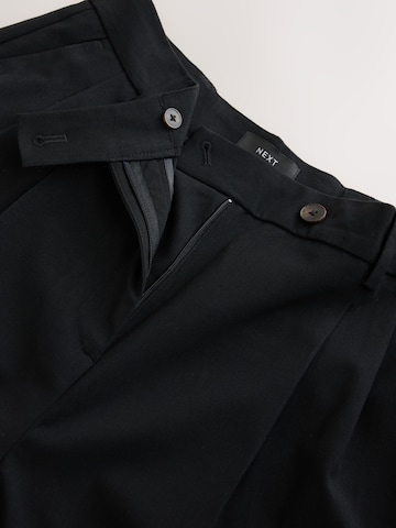 Wide leg Pantaloni con pieghe di Next in nero
