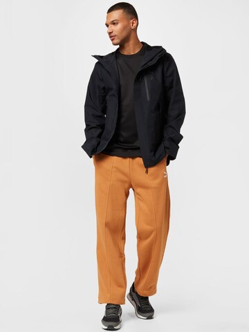 PUMA Loose fit Pants in Brown