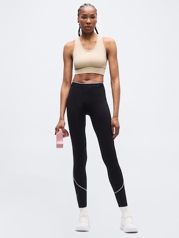Skinny Pantalon de sport 'Elite' UNDER ARMOUR en noir