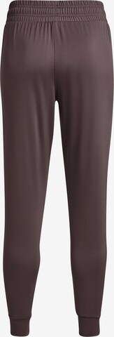 Effilé Pantalon de sport UNDER ARMOUR en marron