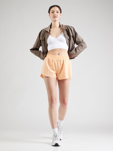 Athlecia - Loosefit Pantalón deportivo 'Arilay' en naranja