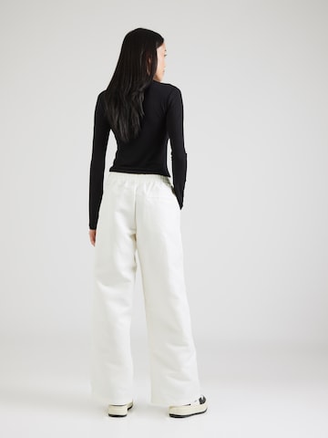 Nike Sportswear Wide Leg Housut 'Windrunner' värissä valkoinen