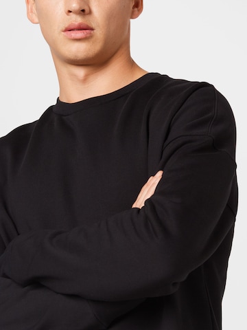 Kosta Williams x About YouSweater majica - crna boja