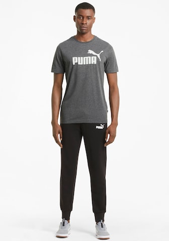 PUMA Functioneel shirt 'Essentials Heather' in Zwart