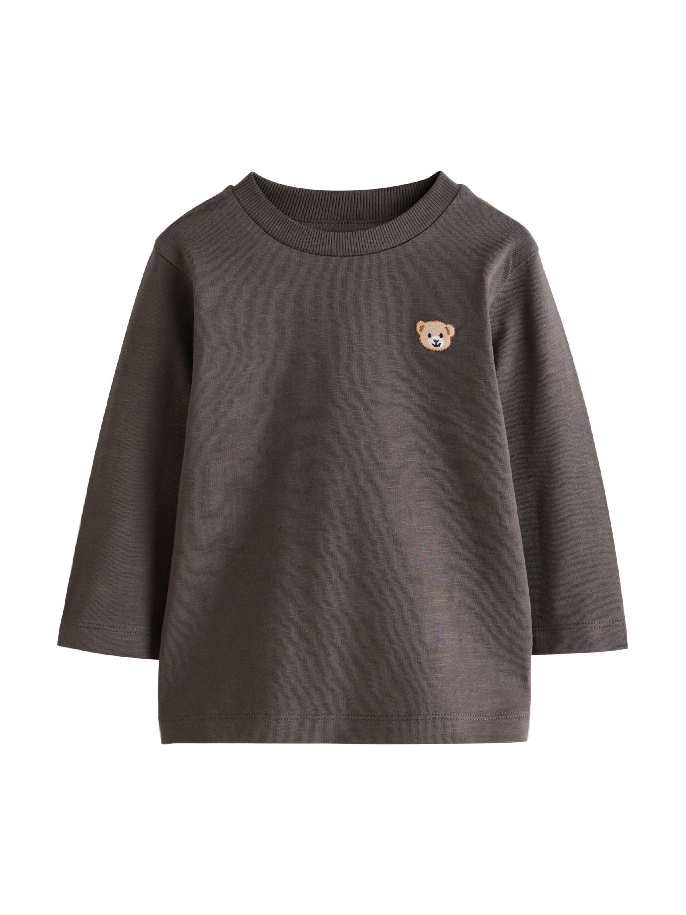 Tricou de la Next pe bej