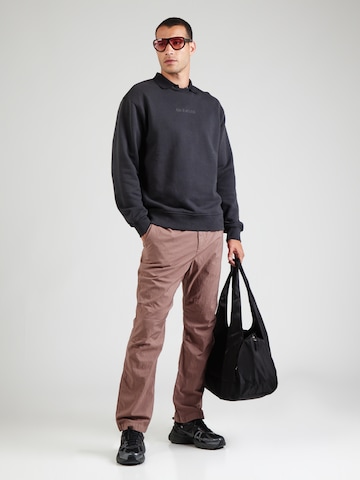 Nike Sportswear Normalny krój Spodnie 'ESC CMPTNL 2.0' w kolorze fioletowy