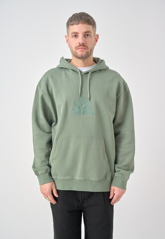 Cleptomanicx Kapuzensweatshirt 'Boxy Hooded Residence' in Grün: Vorderseite