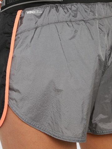 PUMA - Regular Calças de desporto 'LAUNCH' em cinzento