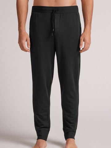 INTIMISSIMI Tapered Hose in Schwarz