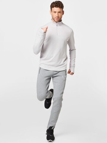 PUMA - Sweatshirt de desporto em cinzento