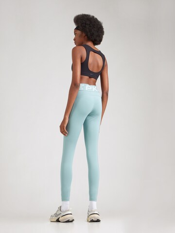 NIKE Skinny Sportbroek in Groen