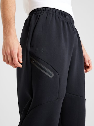 UNDER ARMOUR Tapered Urheiluhousut 'Unstoppable' värissä musta