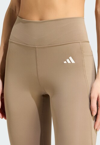 Skinny Pantaloni sportivi 'Opt Ess' di ADIDAS PERFORMANCE in beige