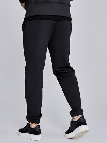 Loosefit Pantaloni di SikSilk in nero