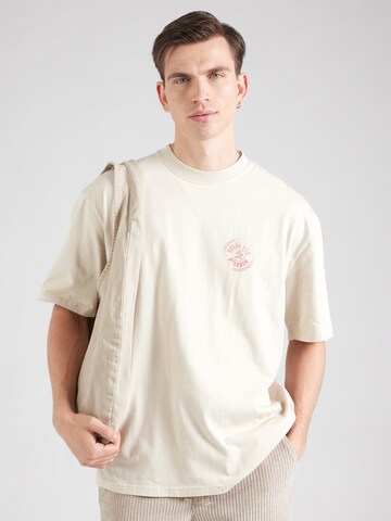 T-Shirt 'Nuevo' Pegador en beige