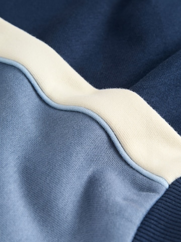 Next - Ropa para correr en azul