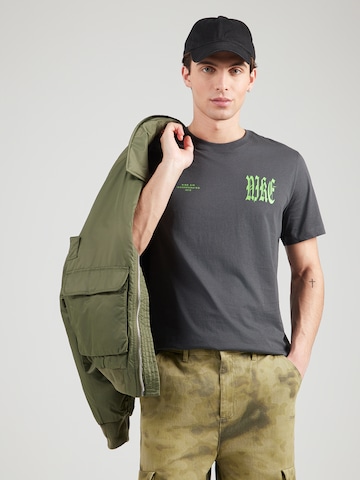 T-Shirt 'WE FLOAT' Nike Sportswear en gris