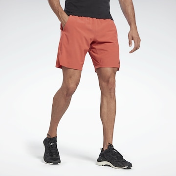 Reebok Sport Workout Pants in Orange: front