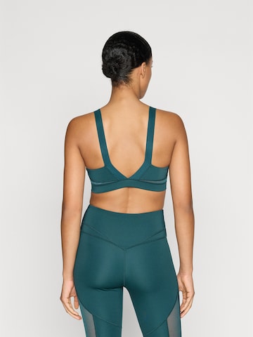 Bustieră Sutien sport 'PWRSHAPE' de la PUMA pe verde