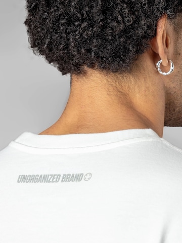 UNORGANIZED BRAND - Camiseta 'SCHWERES OVERSIZE T5' en blanco