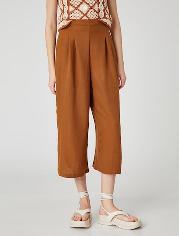 Koton Loose fit Trousers in Brown: front