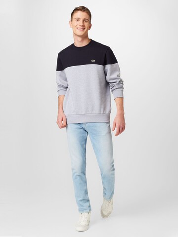 LACOSTE Sweatshirt i blå