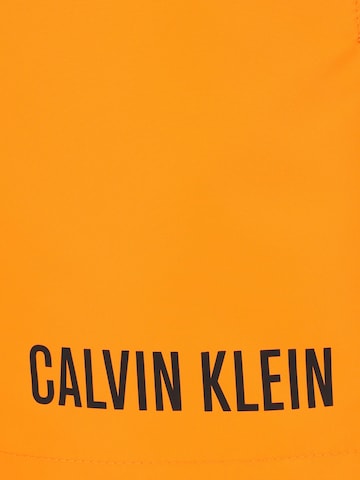Calvin Klein Swimwear Plavecké šortky – oranžová
