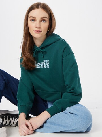 LEVI'S ® Collegepaita 'Graphic Standard Hoodie' värissä vihreä
