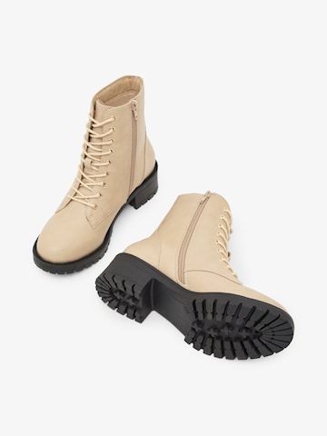Bianco Lace-Up Ankle Boots in Beige