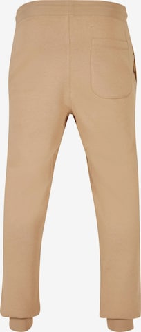 Tapered Pantaloni di Urban Classics in beige