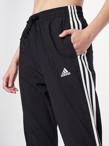 ADIDAS SPORTSWEAR Дънки Tapered Leg Спортен панталон 'Essentials 3-Stripes' в черно