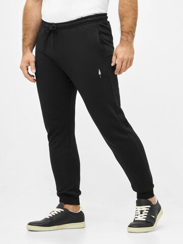 NIKIN Tapered Trousers 'Tree' in Black: front