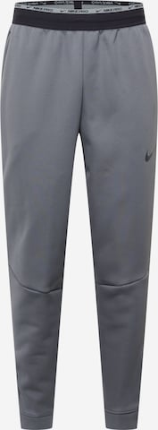 NIKE - Calças de desporto em cinzento: frente