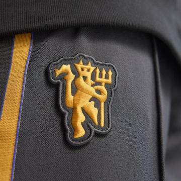 ADIDAS ORIGINALS Конический (Tapered) Спортивные штаны 'Manchester United Terrace Icons' в Черный