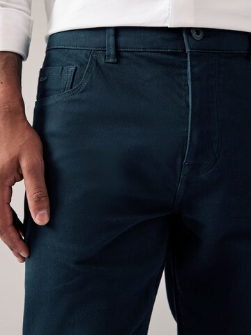 Next Slimfit Chino hlače 'Motion Flex' | modra barva