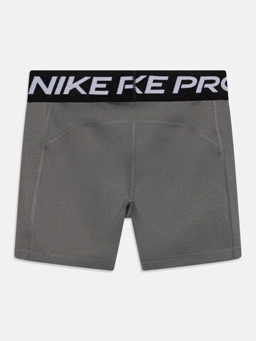 NIKE Skinny Športové nohavice 'Pro' - Sivá