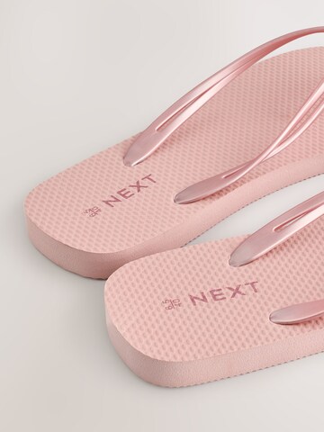 Tongs Next en or