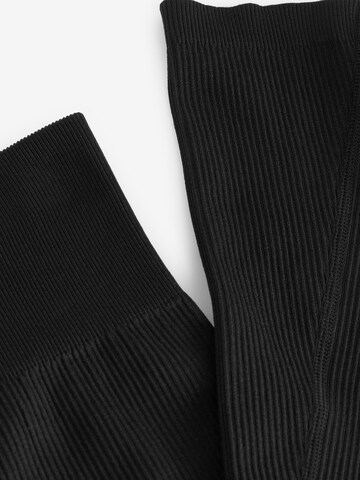 Flared Pantaloni di Next in nero