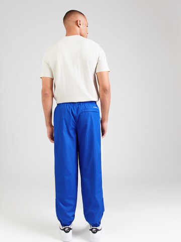 mėlyna Nike Sportswear Siaurėjantis Kelnės