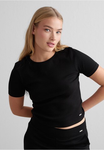 T-shirt fonctionnel Aim'n en noir : devant