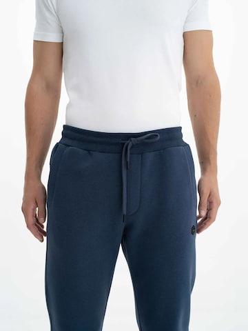 Arma Regular Trousers in Blue