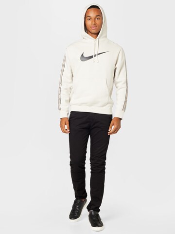 Sweat-shirt 'Repeat' Nike Sportswear en beige