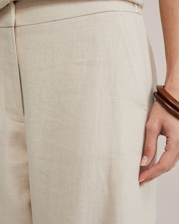 Wide leg Pantaloni di WE Fashion in beige