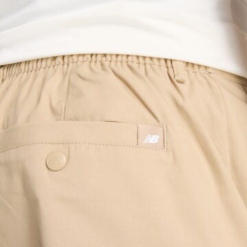 Regular Pantalon chino 'Athletics Standard Tapered' new balance en beige