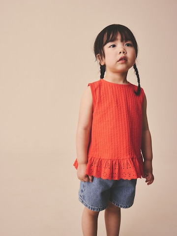 Top di Next in arancione: frontale