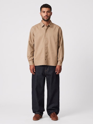 Carhartt WIP Baggy Jeans 'BRANDON' in Blauw: voorkant
