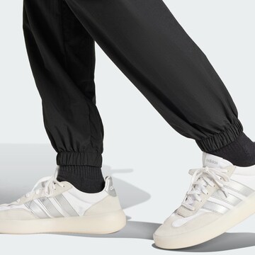 ADIDAS SPORTSWEAR Tapered Sports trousers 'Tiro' in Black