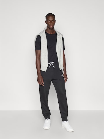 Champion Authentic Athletic Apparel Zwężany krój Spodnie 'Rib Cuff' w kolorze czarny