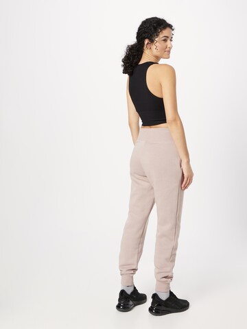 Effilé Pantalon Nike Sportswear en rose