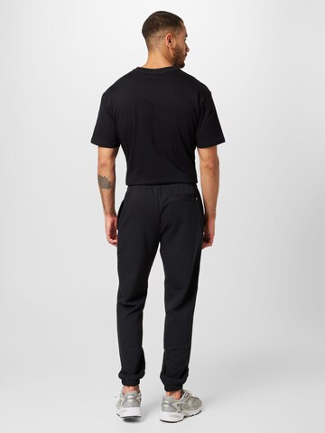 new balance - Tapered Pantalón 'Essentials' en negro